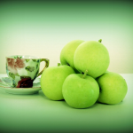 Photo of Granny Smith apples and teacup
